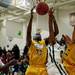 Ypsilanti and Huron players jump for a rebound in the game on Friday, March 8. Daniel Brenner I AnnArbor.com